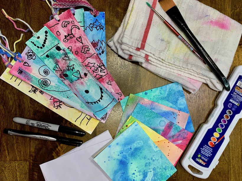 How to use the wet into wet watercolor technique to make bookmarks and notecards with the painted paper!